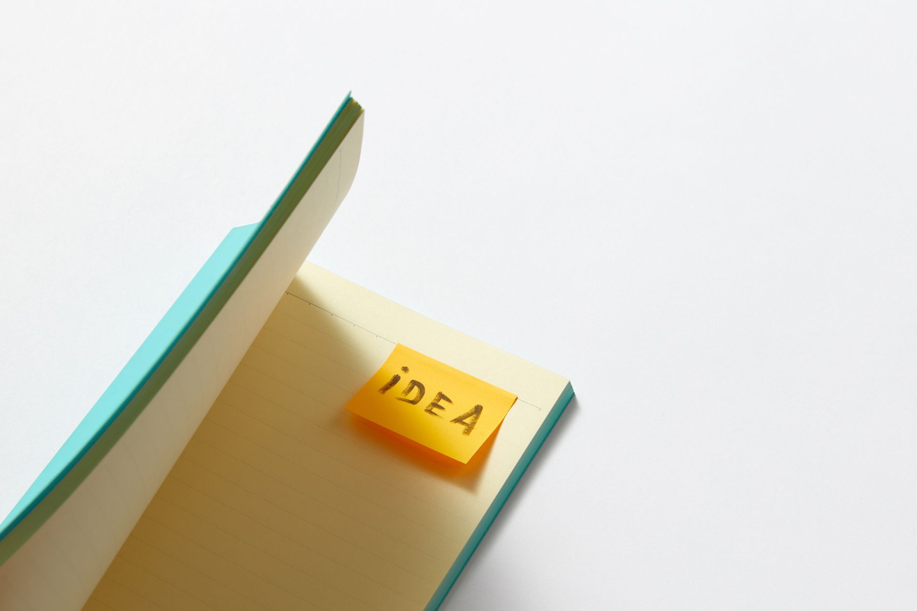 a sticky note in a notebook